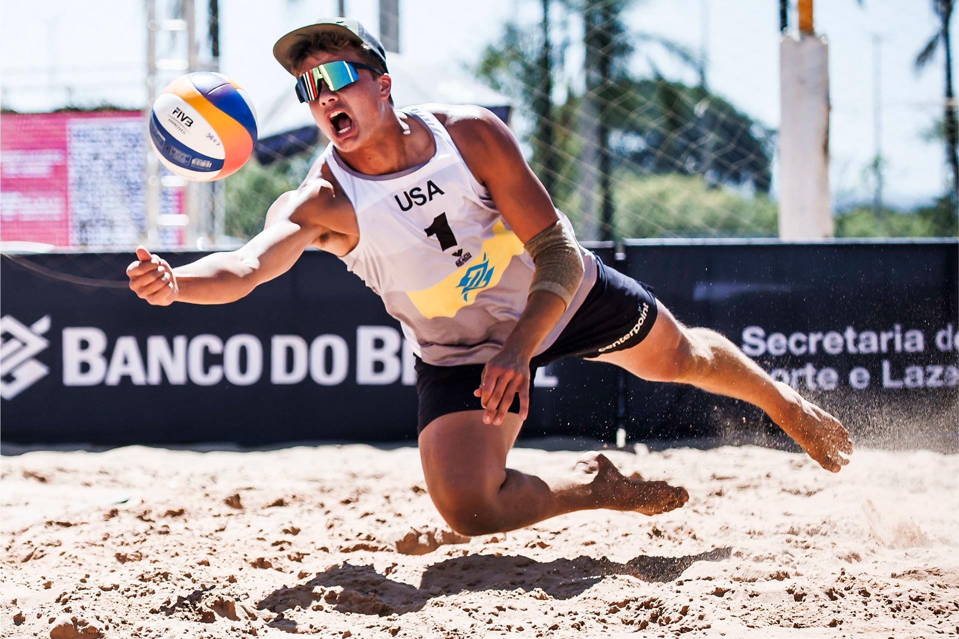 Miles Partain diving for the dig on the beach